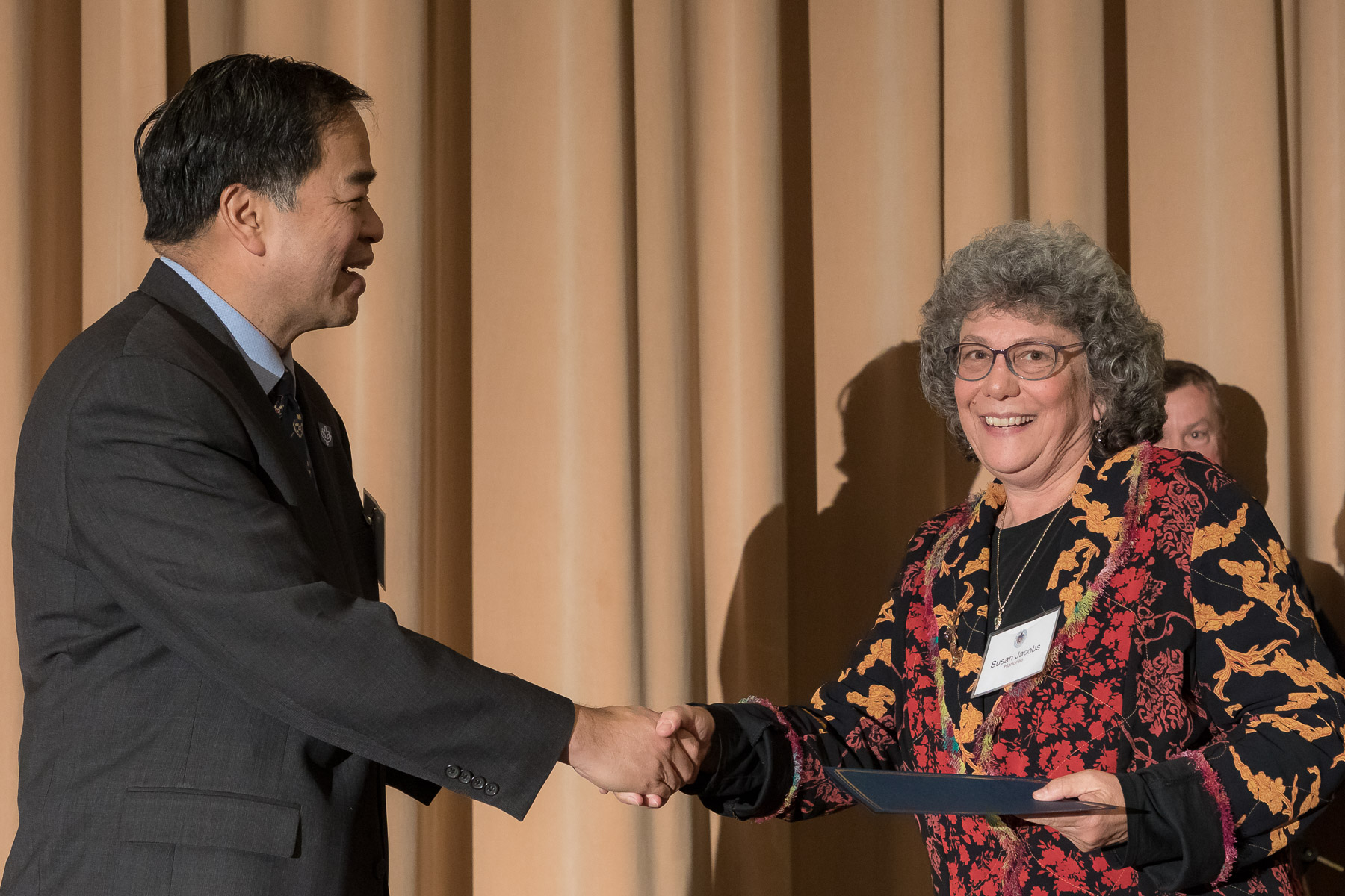 Susan Jacobs, right, with A. Gabriel Esteban, Ph.D., president, as faculty and staff members are inducted into DePaul University's 25 Year Club, Tuesday, Nov. 13, 2018, at the Lincoln Park Student Center. Employees celebrating their 25th work anniversary were honored at the luncheon with their colleagues and will have their names added to plaques located on the Loop and Lincoln Park Campuses. (DePaul University/Jeff Carrion)